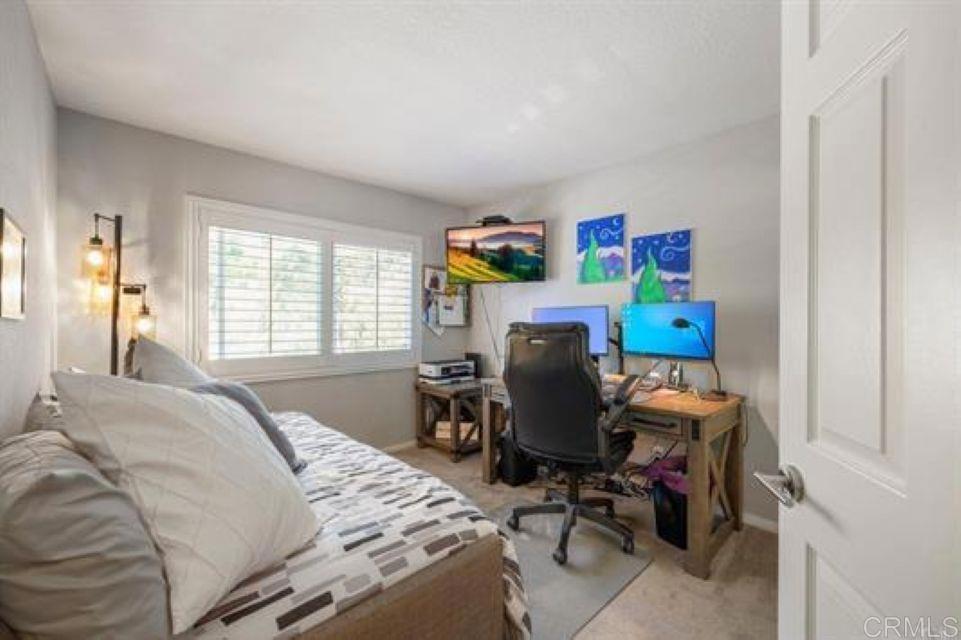2277 Dunstan Street Oceanside, CA 92054 - Photo 21 of 36 a bedroom with a bed and a window