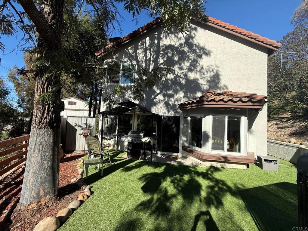 2277 Dunstan Street Oceanside, CA 92054 - Photo 27 of 36 a view of a house with a yard