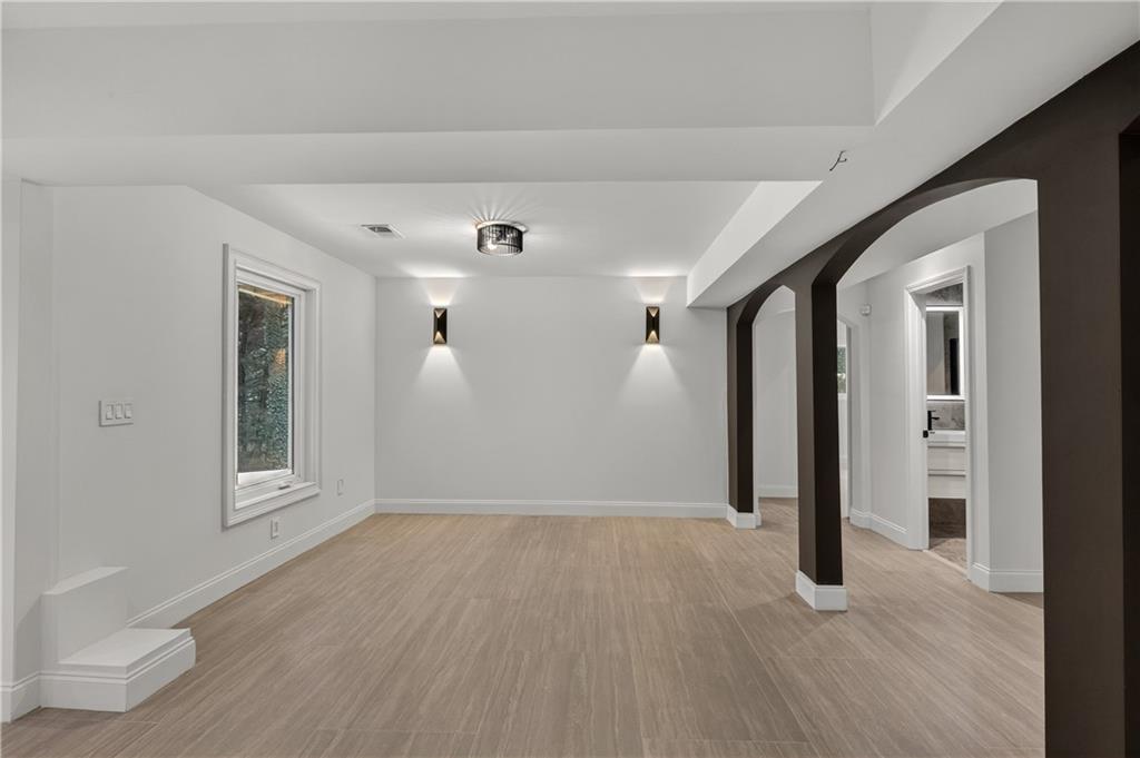 4610 West Morton Road Alpharetta, GA 30022 - Photo 40 of 53 a view of an empty room with wooden floor and a window
