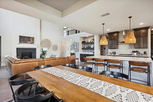 a living room with fireplace furniture and a wooden floor