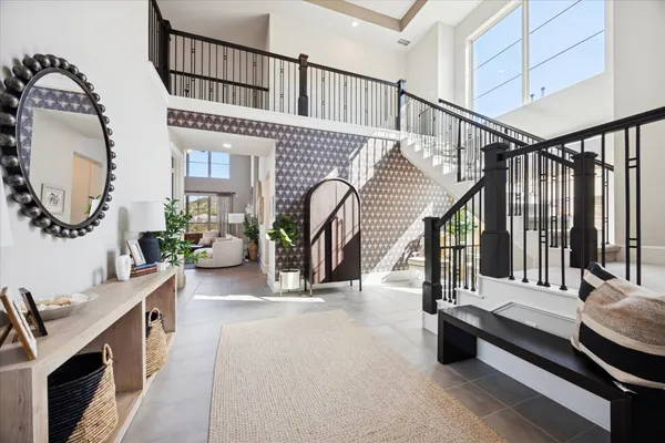 a view of staircase with furniture and a window