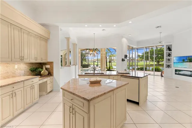 a kitchen with stainless steel appliances granite countertop a stove and a sink