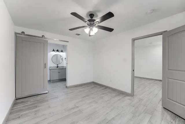 wooden floor in an empty room and a window