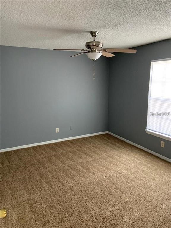 1055 South Hiawassee Road, Unit 2012 Orlando, FL 32835 - Photo 14 of 19 a view of an empty room with a window