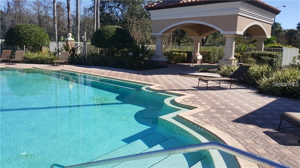 1055 South Hiawassee Road, Unit 2012 Orlando, FL 32835 - Photo 17 of 19 a view of pool with garden