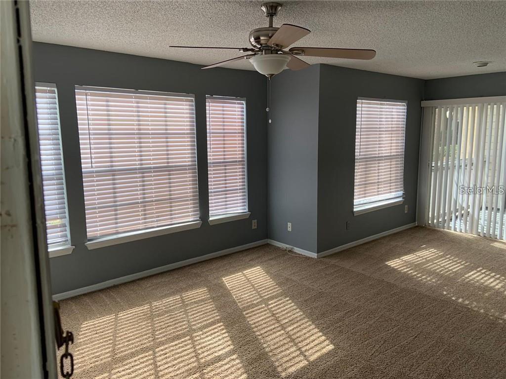 1055 South Hiawassee Road, Unit 2012 Orlando, FL 32835 - Photo 2 of 19 a view of an empty room with a window