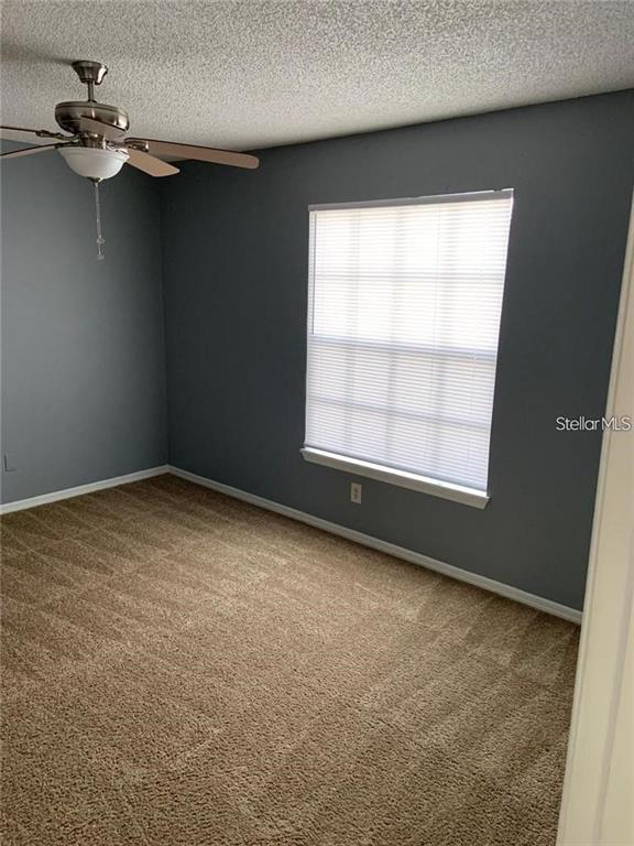 1055 South Hiawassee Road, Unit 2012 Orlando, FL 32835 - Photo 8 of 19 an empty room with a window