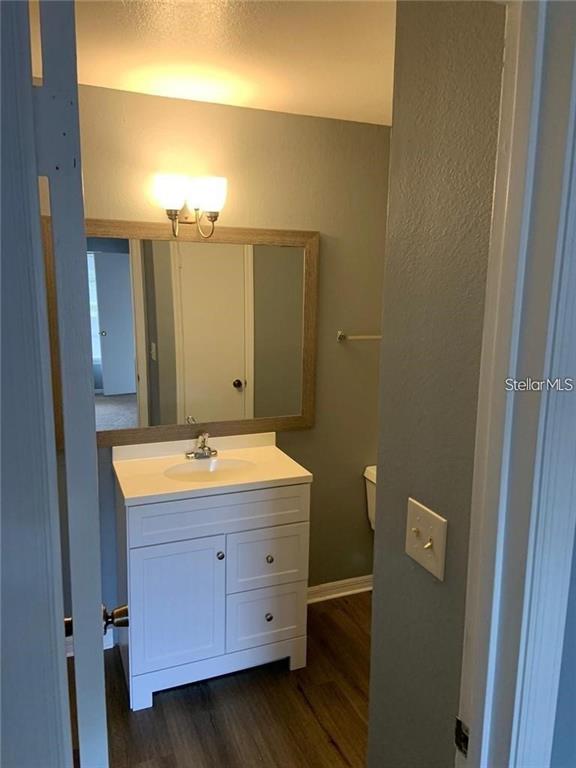 1055 South Hiawassee Road, Unit 2012 Orlando, FL 32835 - Photo 10 of 19 a bathroom with a sink and a mirror