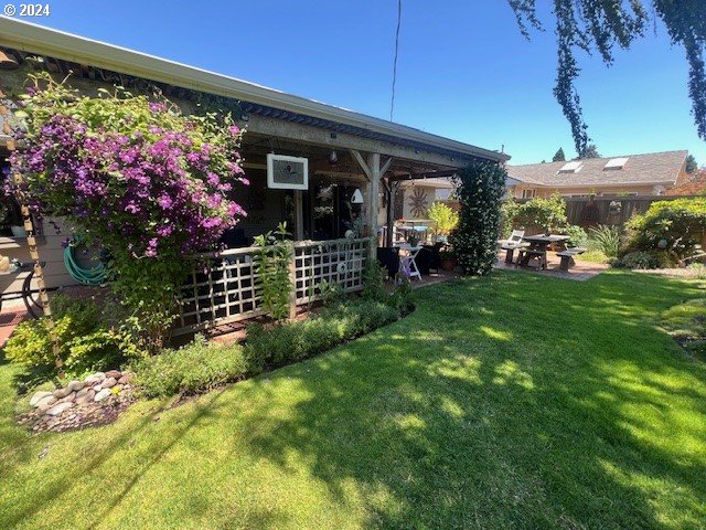 187 Greenvale Drive Springfield, OR 97477 - Photo 33 of 36 a view of a house with a flower garden