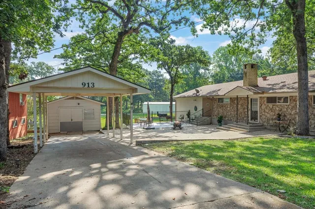 a front view of a house with a yard and porch