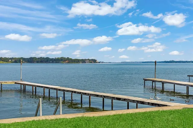 a view of a lake with a garden