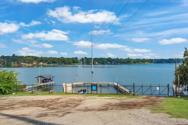 a view of a lake with houses in the back