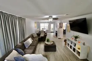 a living room with furniture and a flat screen tv