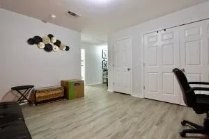 a view of a workspace with furniture and a gate