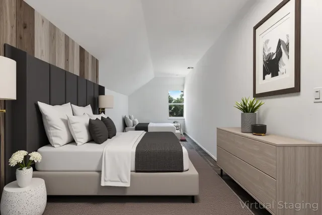 a bedroom with bed and a potted plant