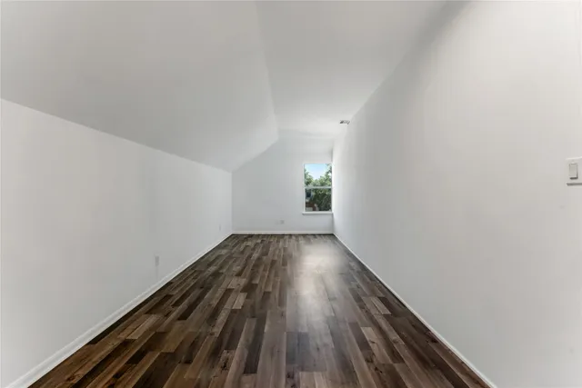 a view of wooden floor in an empty room