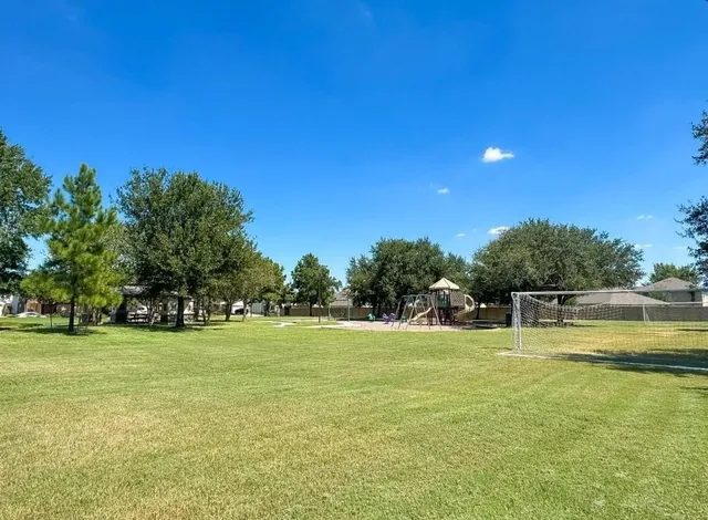 a view of a swimming pool with an outdoor space and seating area
