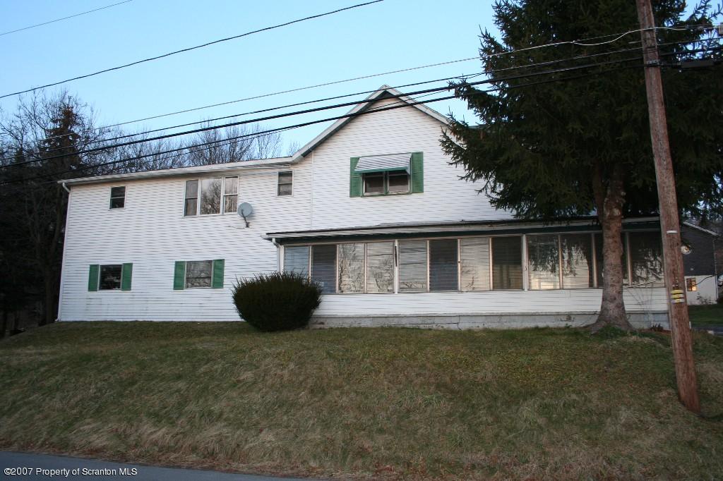 2312 Main St/old State Road Moscow, PA 18444 - Photo 1 of 1 a front view of a house with a garden