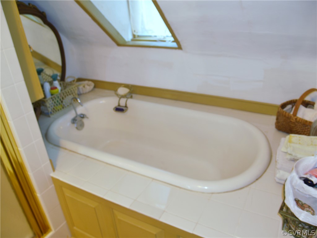 11221 Carriage Road Providence Forge, VA 23140 - Photo 32 of 44 Antique Tub has been Enclosed in Tile and Frame Su