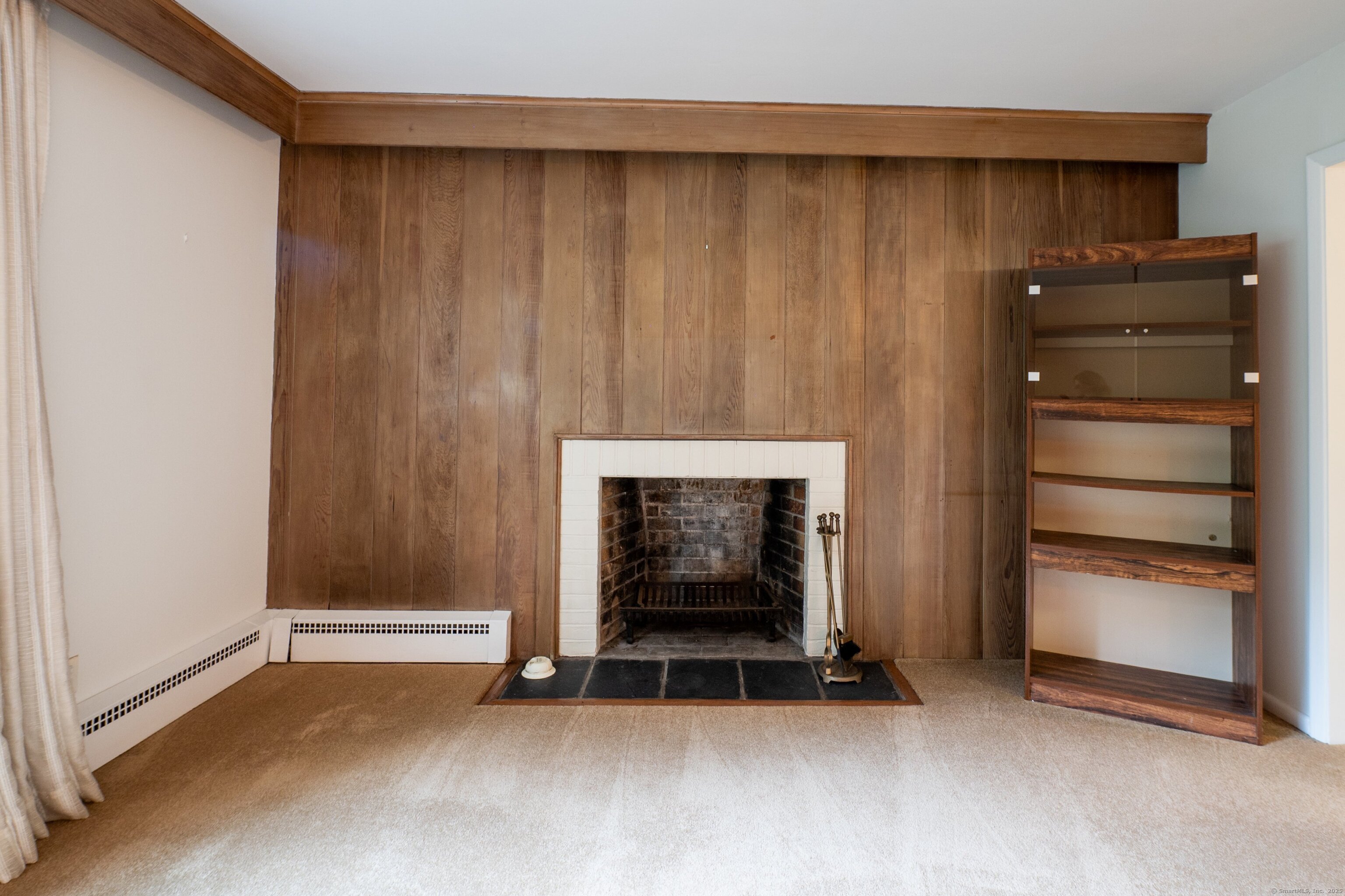 588 Summit Drive Orange, CT 06477 - Photo 12 of 40 a room with a fireplace