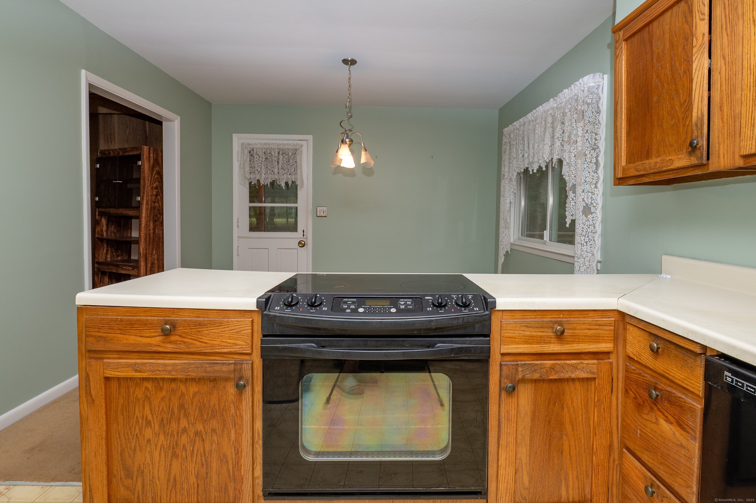588 Summit Drive Orange, CT 06477 - Photo 14 of 40 a kitchen with a stove and a microwave