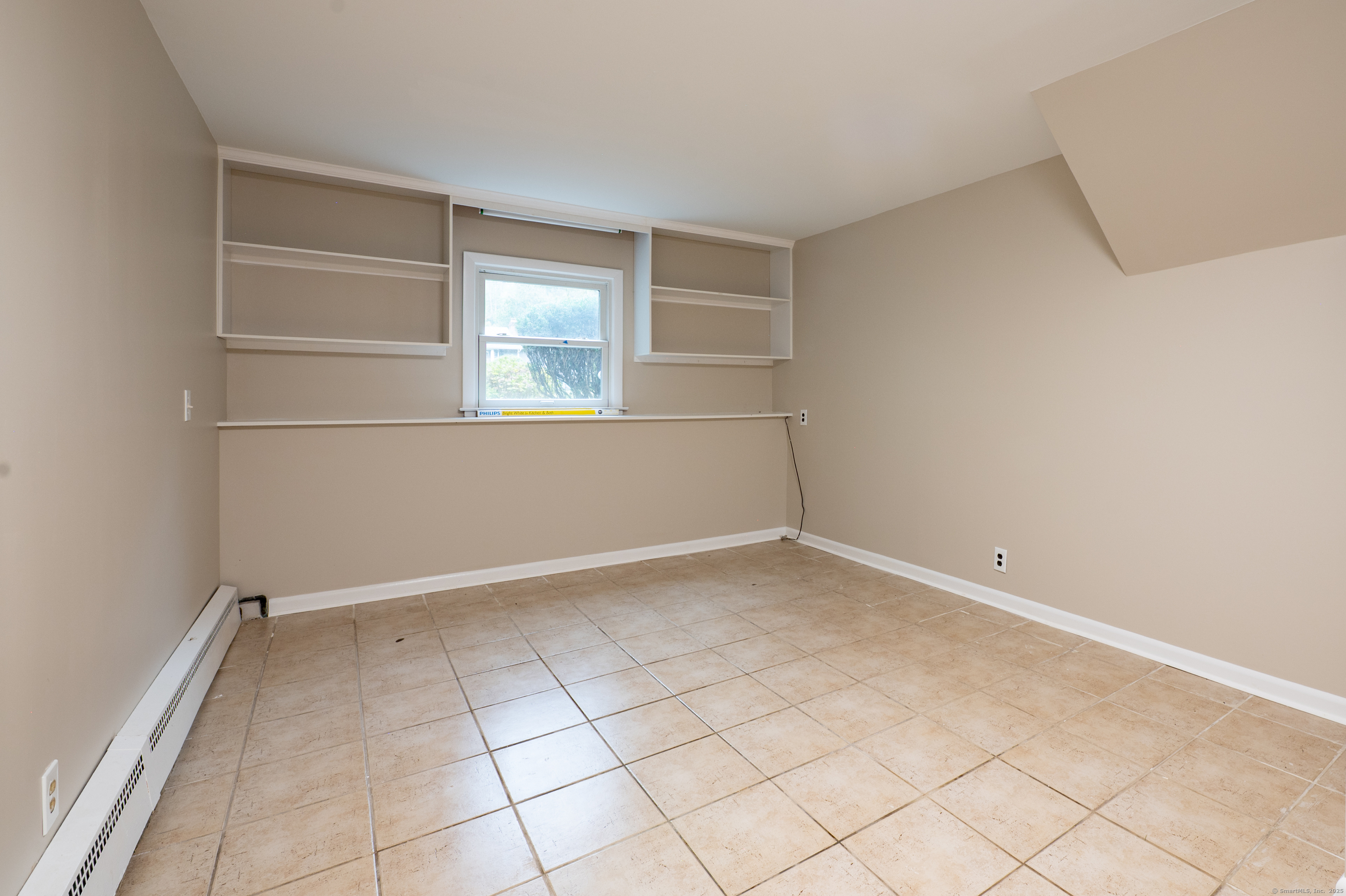 588 Summit Drive Orange, CT 06477 - Photo 32 of 40 a view of an empty room with a window