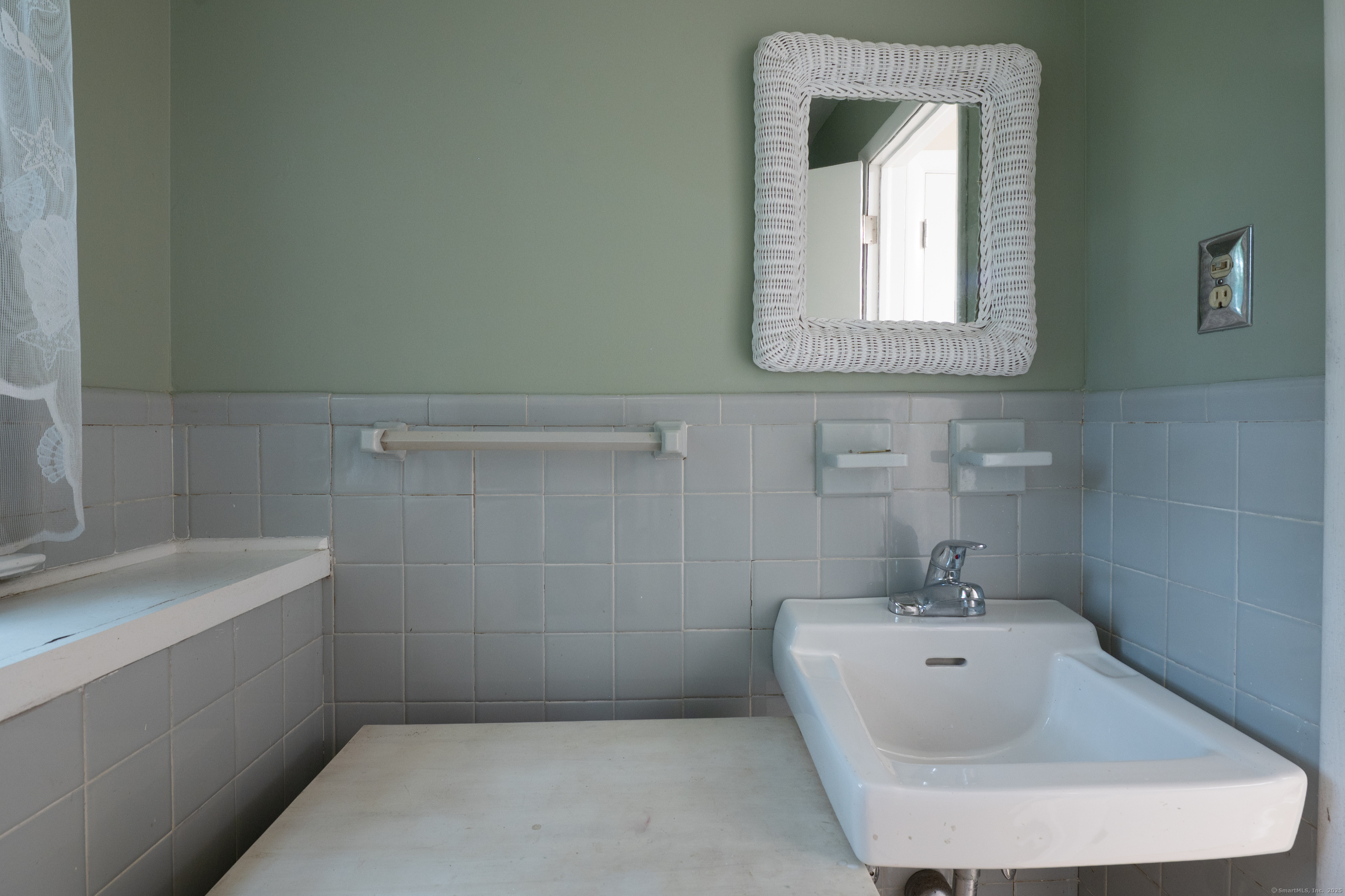 588 Summit Drive Orange, CT 06477 - Photo 35 of 40 a bathroom with a tub a sink and a window