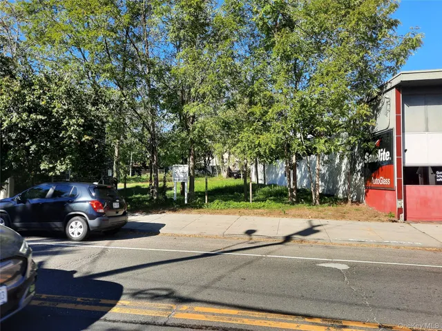 a view of street with parked cars