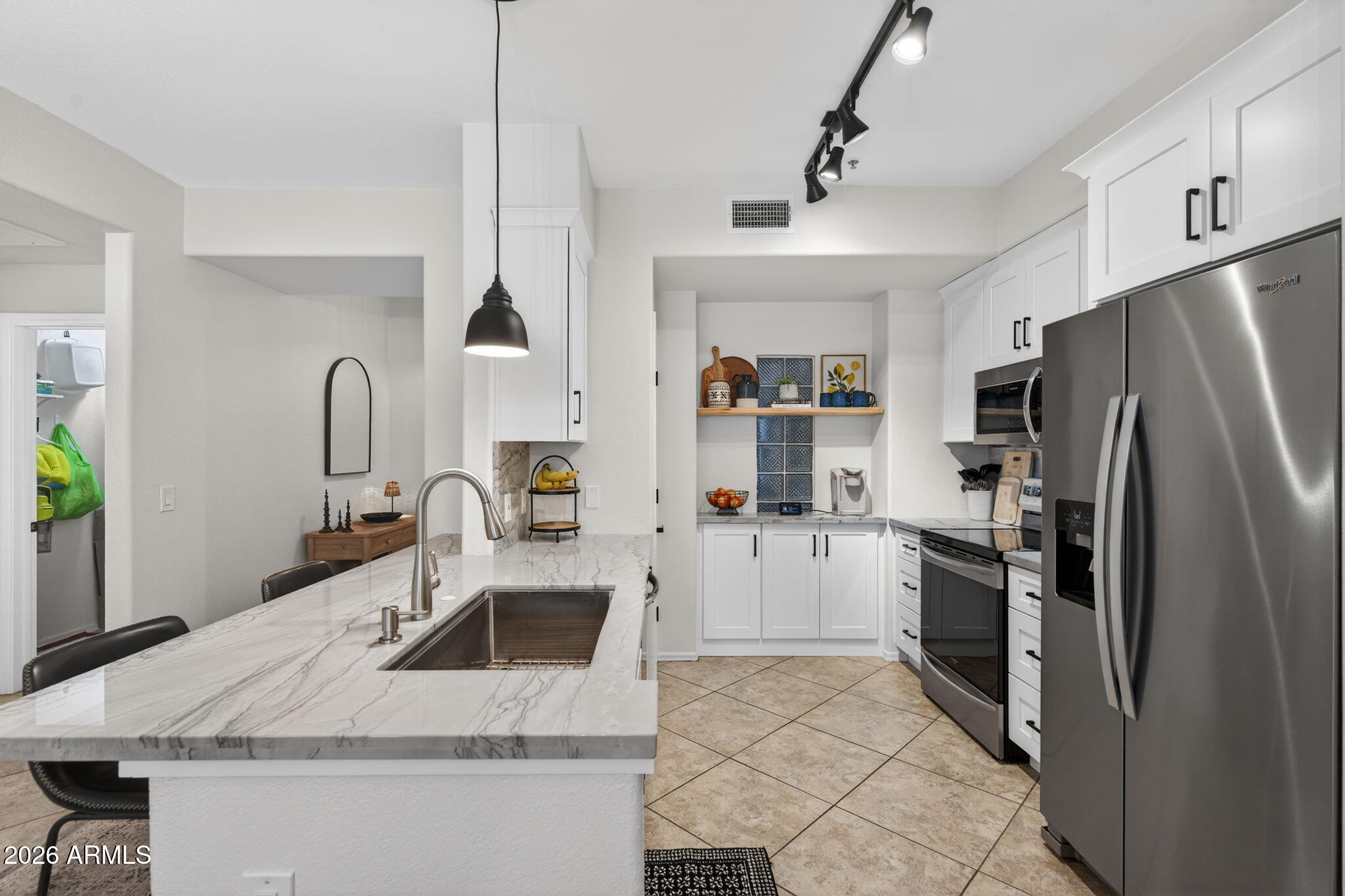 435 West Rio Salado Parkway, Unit 204 Tempe, AZ 85281 - Photo 1 of 60 a kitchen with stainless steel appliances granite countertop a sink stove and refrigerator