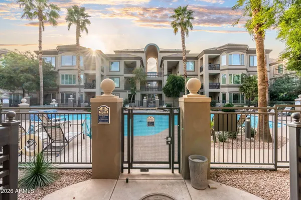 a view of a swimming pool with a table and chairs