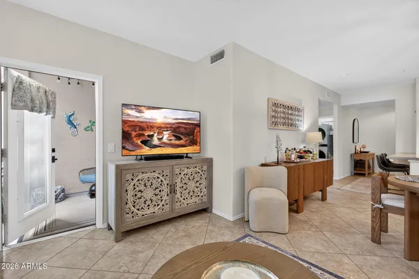 a living room with furniture and a large window