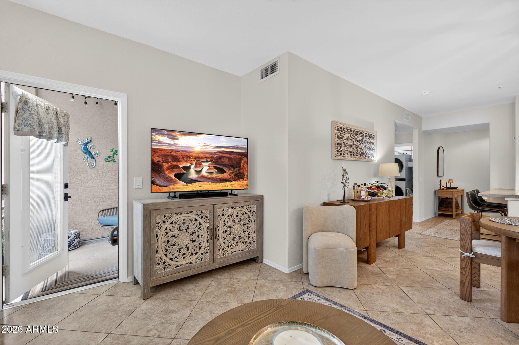 435 West Rio Salado Parkway, Unit 204 Tempe, AZ 85281 - Photo 16 of 60 a living room with furniture and a flat screen tv