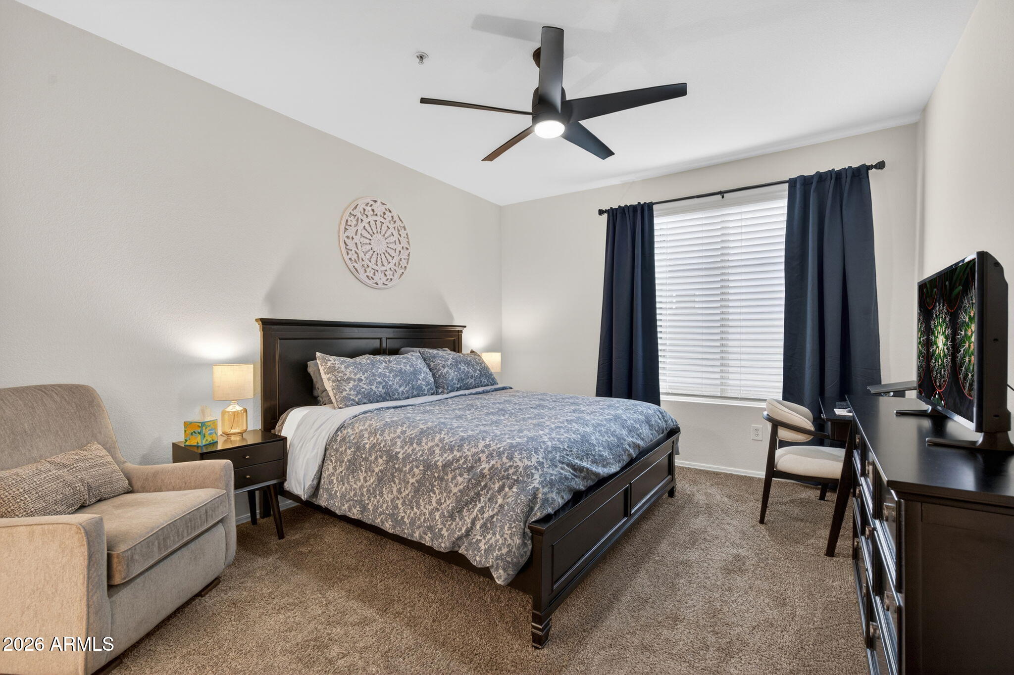 435 West Rio Salado Parkway, Unit 204 Tempe, AZ 85281 - Photo 17 of 60 a bedroom with a bed furniture and a flat screen tv