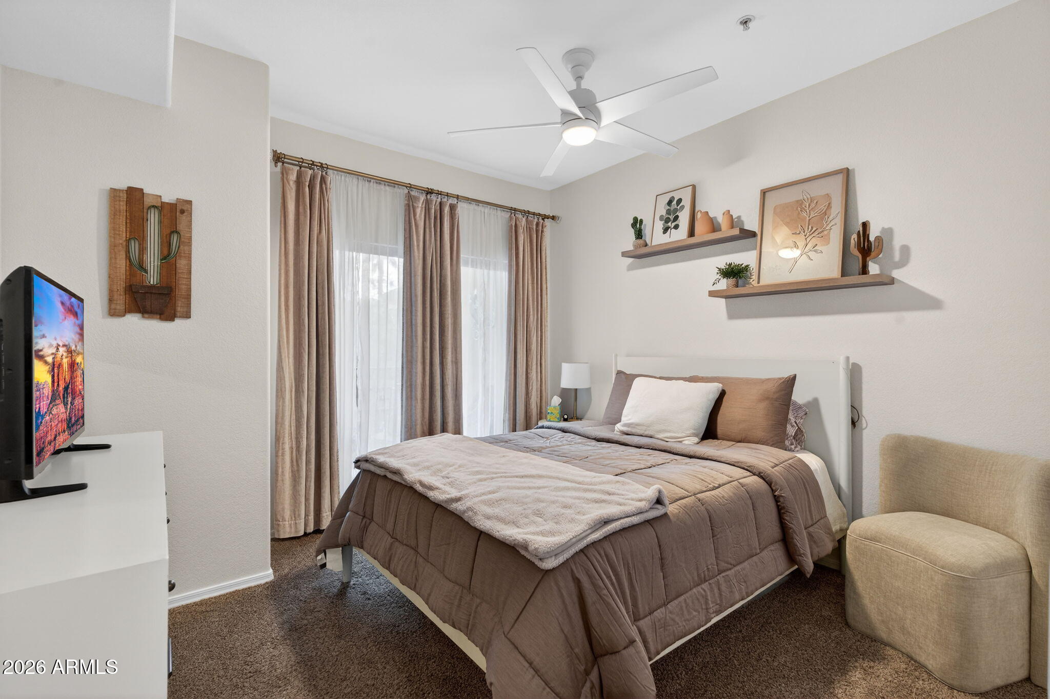 435 West Rio Salado Parkway, Unit 204 Tempe, AZ 85281 - Photo 23 of 60 a bedroom with a bed a window and a flat screen television
