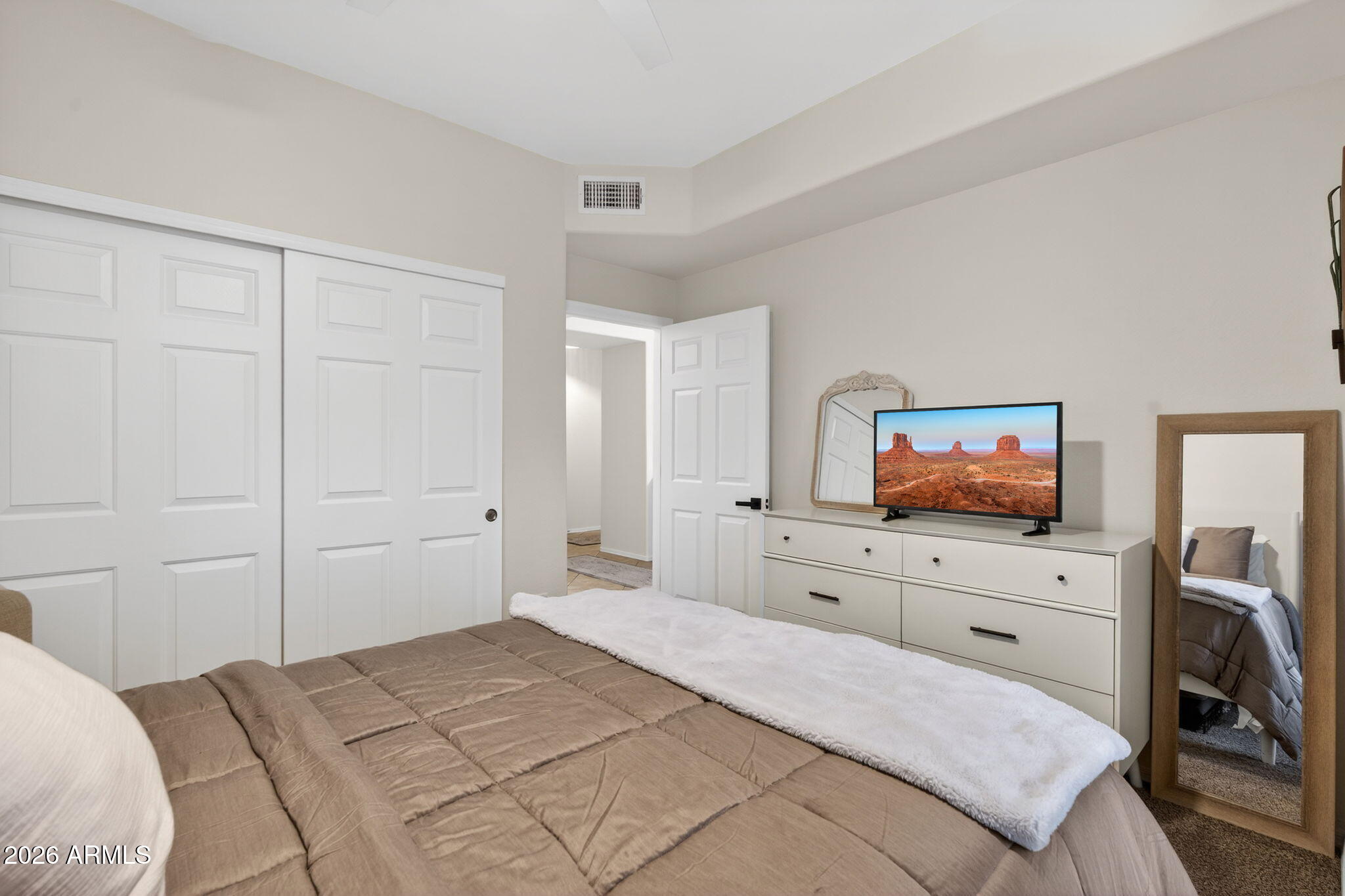 435 West Rio Salado Parkway, Unit 204 Tempe, AZ 85281 - Photo 24 of 60 a bedroom with a bed and a flat screen tv