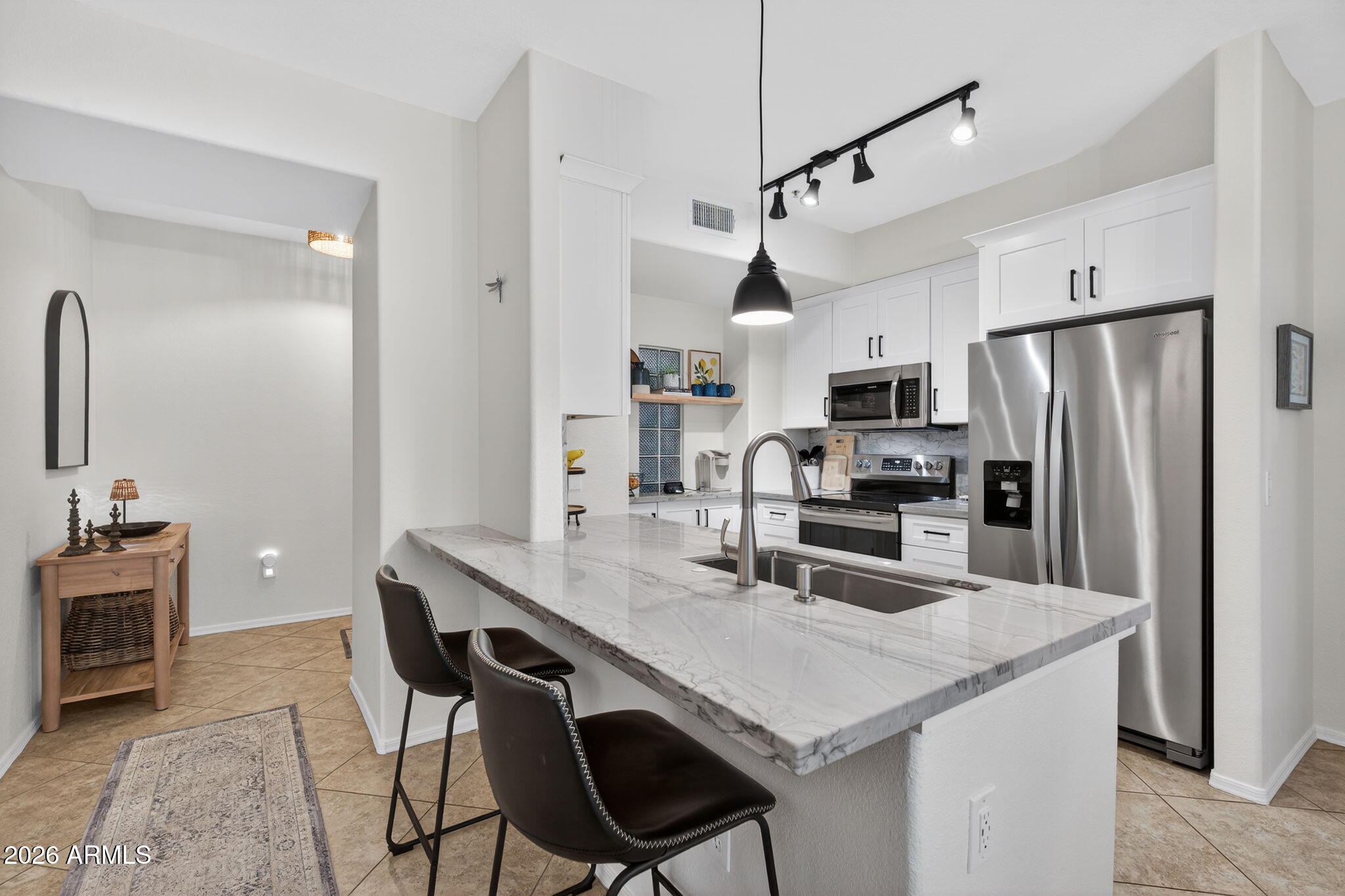 435 West Rio Salado Parkway, Unit 204 Tempe, AZ 85281 - Photo 3 of 60 a kitchen with granite countertop a counter space stainless steel appliances and cabinets