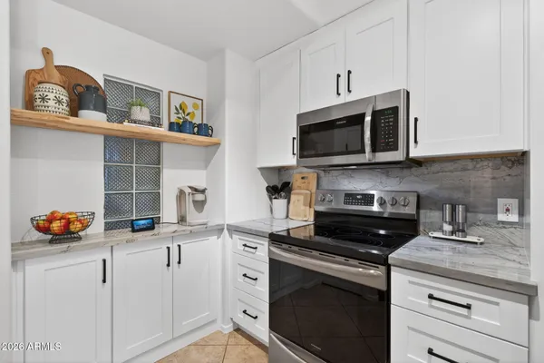 a very nice looking open dining room with kitchen island furniture and a wooden floor