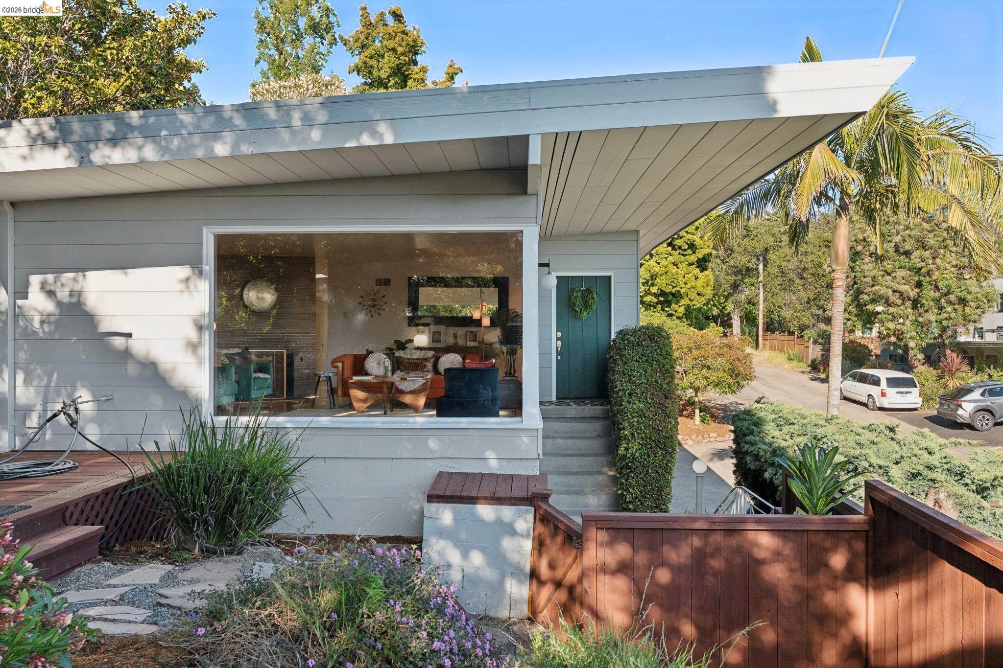 2301 Oak Street Berkeley, CA 94708 - Photo 30 of 61 Contemporary exterior with light gray siding and a dramatic angled roofline