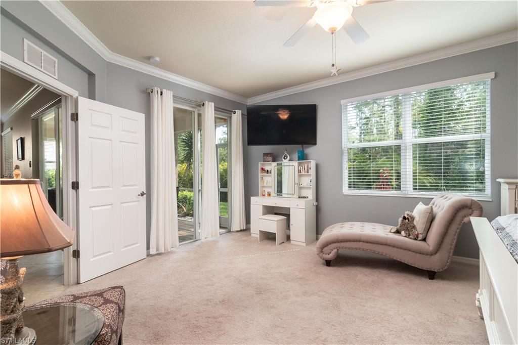 7878 Clemson Street, Unit 101 Naples, FL 34104 - Photo 11 of 18 a living room with furniture and a window