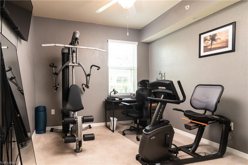 7878 Clemson Street, Unit 101 Naples, FL 34104 - Photo 16 of 18 a view of a room with gym equipment
