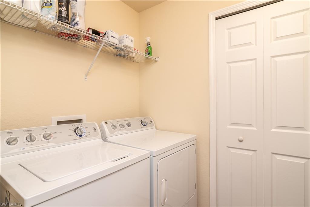 7878 Clemson Street, Unit 101 Naples, FL 34104 - Photo 17 of 18 a utility room with dryer and washer