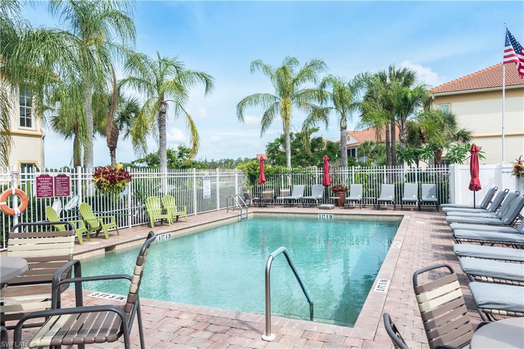 7878 Clemson Street, Unit 101 Naples, FL 34104 - Photo 18 of 18 a view of swimming pool with outdoor seating and plants