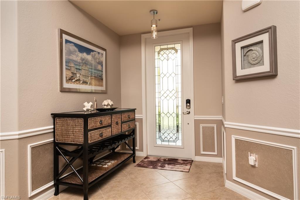 7878 Clemson Street, Unit 101 Naples, FL 34104 - Photo 2 of 18 a view of an entryway with front door