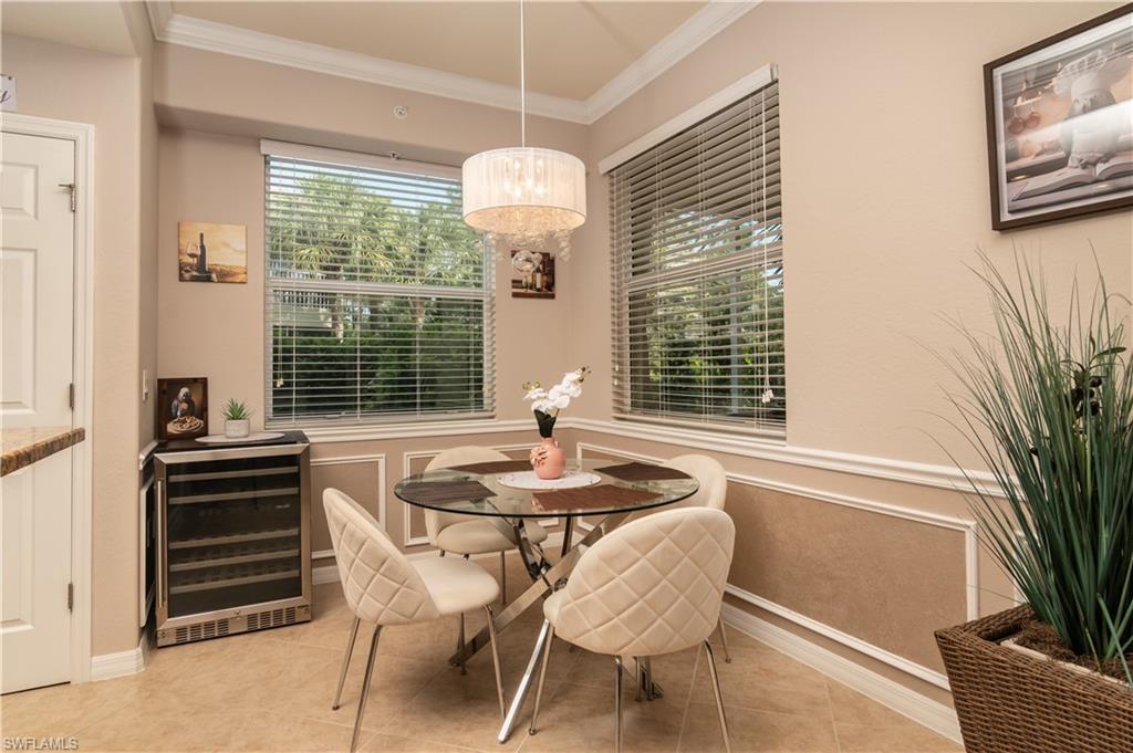 7878 Clemson Street, Unit 101 Naples, FL 34104 - Photo 7 of 18 a dining room with furniture and window