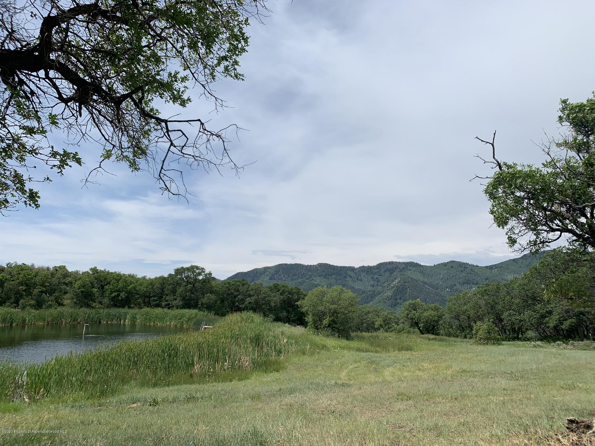 Tbd Wild Acres Ranch Road Rifle, CO 81650 - Photo 12 of 33 a view of a mountain with a yard