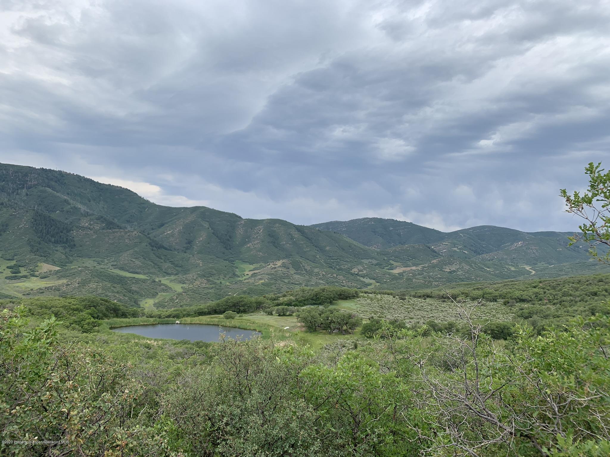 Tbd Wild Acres Ranch Road Rifle, CO 81650 - Photo 17 of 33 a view of an mountain range with lush green forest