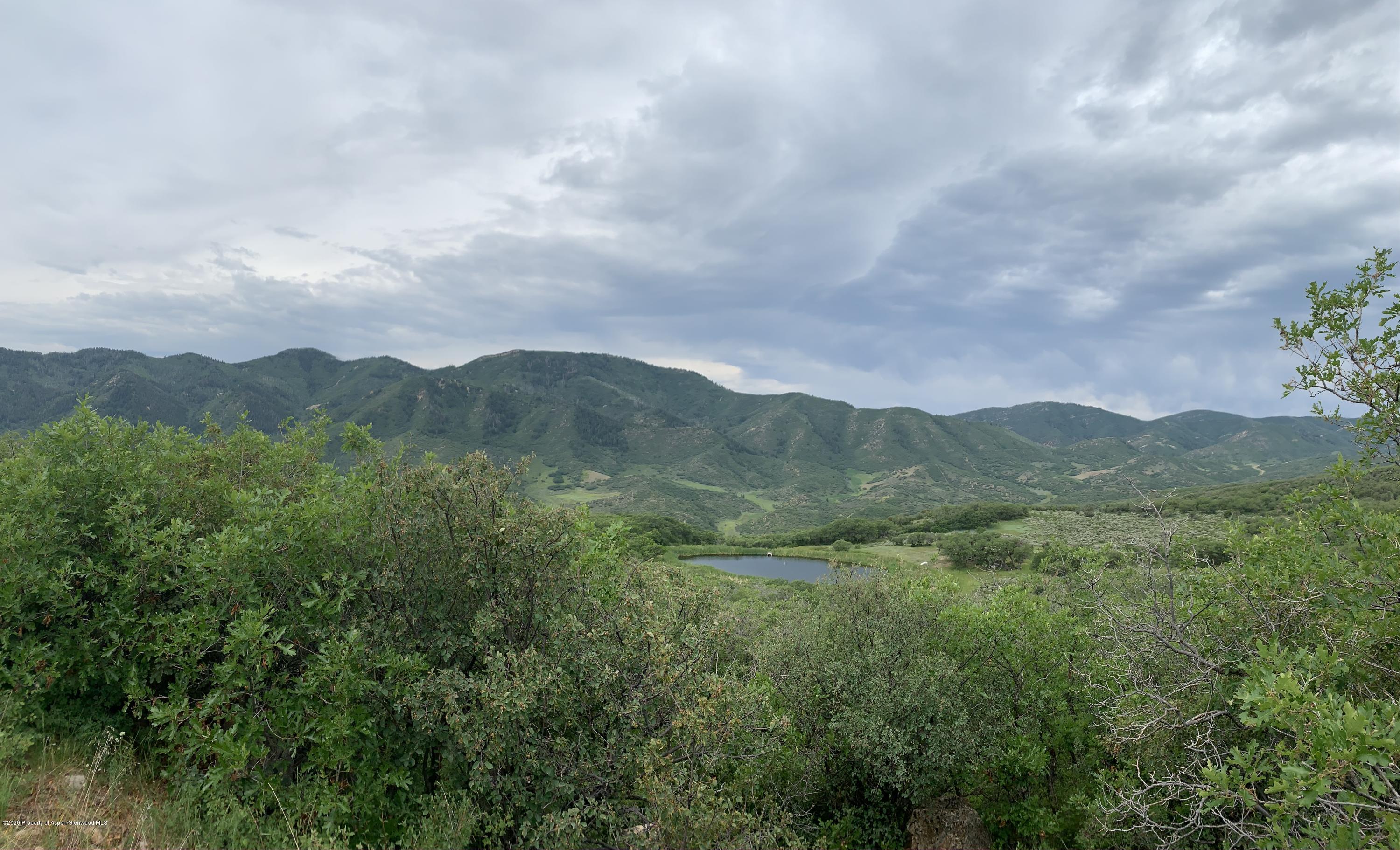 Tbd Wild Acres Ranch Road Rifle, CO 81650 - Photo 18 of 33 a view of a city with mountains in the background