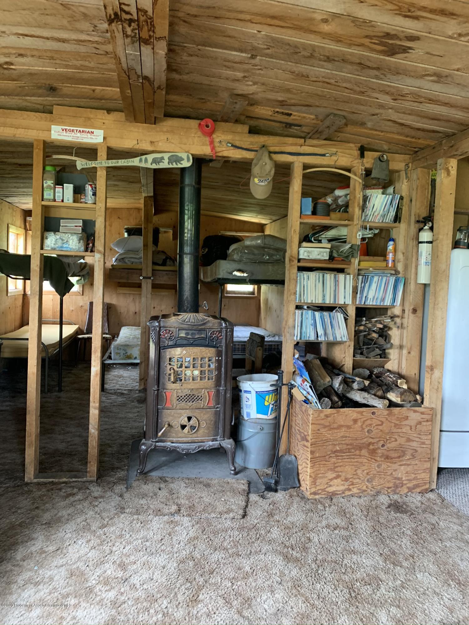 Tbd Wild Acres Ranch Road Rifle, CO 81650 - Photo 5 of 33 a view of store room with wooden floor