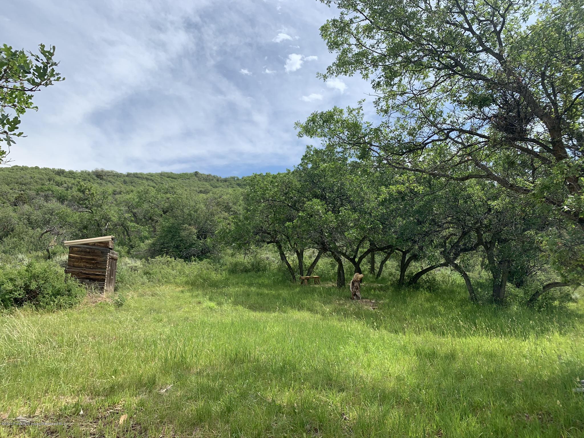 Tbd Wild Acres Ranch Road Rifle, CO 81650 - Photo 9 of 33 a view of a garden with a bench in a garden