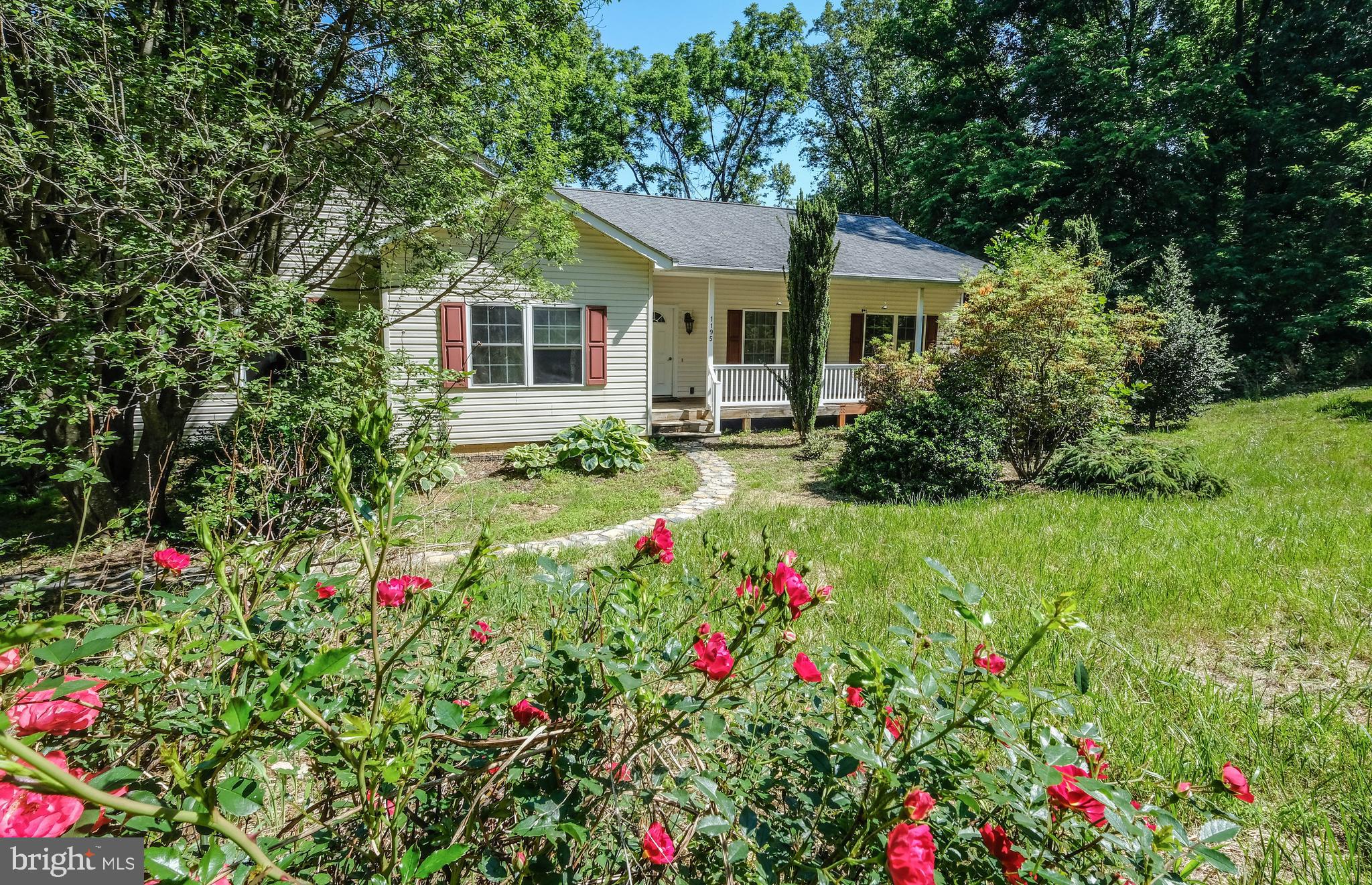 1195 Shangri-La Road Bentonville, VA 22610 - Photo 2 of 64 a view of a house with big yard and potted plants